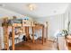 Inviting bedroom with bunk beds, stylish wallpaper, comfortable seating, and a functional workspace at 5035 Gum Tree Ln, Johns Island, SC 29455