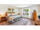 Bedroom featuring a comfortable bed, bright window, hardwood floors, and tasteful decor at 5035 Gum Tree Ln, Johns Island, SC 29455