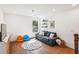 Bonus room with hardwood floors, comfortable seating, and a view of the outdoors at 5035 Gum Tree Ln, Johns Island, SC 29455