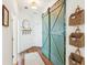 Stylish entryway with wood flooring, rustic sliding doors, and decorative baskets at 5035 Gum Tree Ln, Johns Island, SC 29455