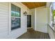 Inviting porch with window, door, and wood plank flooring at 5035 Gum Tree Ln, Johns Island, SC 29455