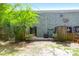 Fenced backyard with brick building, greenery, and an outdoor living space at 507 Stinson Dr # 7F, Charleston, SC 29407