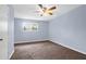 Bedroom featuring a ceiling fan, carpet, and a sunlit window at 507 Stinson Dr # 7F, Charleston, SC 29407