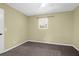 Bedroom featuring neutral walls, carpeting, ceiling fan, and a bright window at 507 Stinson Dr # 7F, Charleston, SC 29407