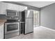 Efficient kitchen with stainless steel appliances, laminate flooring and neutral grey walls at 507 Stinson Dr # 7F, Charleston, SC 29407