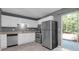 Efficient kitchen featuring stainless steel appliances and sliding glass doors to backyard at 507 Stinson Dr # 7F, Charleston, SC 29407