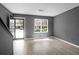 Bright living room with new laminate flooring, grey walls, and lots of natural light at 507 Stinson Dr # 7F, Charleston, SC 29407