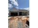 Single-story home featuring a two-car garage and a charming covered front porch at 625 Marsh Cove Cir, Summerville, SC 29486