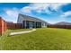 Expansive backyard with lush green lawn, brick paver walkway and a full privacy fence at 706 Squire Pope Rd, Summerville, SC 29486