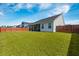 Large, well-maintained backyard with a full privacy fence, screened porch and lush green lawn at 706 Squire Pope Rd, Summerville, SC 29486