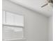 Bright bedroom with ceiling fan and light filtering blinds on the window provide a comfortable space at 706 Squire Pope Rd, Summerville, SC 29486