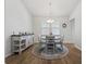 Bright dining room with white trim, round table, decorative accents and modern lighting at 706 Squire Pope Rd, Summerville, SC 29486
