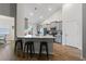 Modern kitchen featuring stainless steel appliances, sleek gray cabinets, and a spacious island with barstool seating at 706 Squire Pope Rd, Summerville, SC 29486