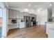 Bright kitchen features gray cabinets, stainless steel appliances and a built-in desk area at 706 Squire Pope Rd, Summerville, SC 29486