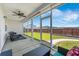 View of the screened lanai with comfortable seating and views of the backyard at 706 Squire Pope Rd, Summerville, SC 29486