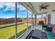 Cozy screened-in porch offers outdoor living space with views of the lush backyard and privacy fence at 706 Squire Pope Rd, Summerville, SC 29486
