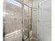 Modern glass shower featuring tile surround and a built-in bench at 706 Squire Pope Rd, Summerville, SC 29486