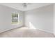 Bright and airy bedroom with a window view of a charming neighborhood at 712 Bent Hickory Rd, Charleston, SC 29414