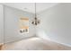 Bright and airy dining room with natural lighting and a decorative chandelier at 712 Bent Hickory Rd, Charleston, SC 29414