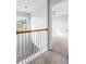 Hallway featuring a chandelier and a view into a room with a ceiling fan at 712 Bent Hickory Rd, Charleston, SC 29414