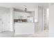 Bright, modern kitchen with white cabinets, stainless steel appliances, and stylish backsplash at 712 Bent Hickory Rd, Charleston, SC 29414