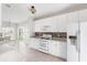 Bright kitchen featuring white cabinets, stainless steel appliances, and a breakfast bar area at 712 Bent Hickory Rd, Charleston, SC 29414