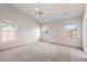 Large main bedroom with a vaulted ceiling, multiple windows, and a ceiling fan at 712 Bent Hickory Rd, Charleston, SC 29414