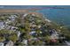 Picturesque aerial view of charming coastal homes surrounded by lush greenery and scenic waterfront piers at 731 Pitt St, Mount Pleasant, SC 29464