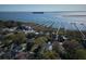 Stunning aerial view of waterfront homes with private boat docks, offering a luxurious lifestyle at 731 Pitt St, Mount Pleasant, SC 29464