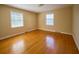 Bedroom with hardwood floors, large windows, and neutral walls, ready for personalization at 731 Pitt St, Mount Pleasant, SC 29464