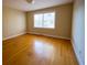 Bright, airy bedroom featuring hardwood floors and a large window for natural light at 731 Pitt St, Mount Pleasant, SC 29464