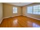 Cozy bedroom with hardwood flooring, bright windows, and a neutral color palette at 731 Pitt St, Mount Pleasant, SC 29464