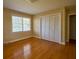 Inviting bedroom with hardwood floors, ample natural light, and closet space at 731 Pitt St, Mount Pleasant, SC 29464