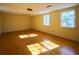 Sunlit bonus room featuring hardwood floors, multiple windows, and space for various activities at 731 Pitt St, Mount Pleasant, SC 29464
