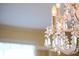 Elegant chandelier with crystals and lights adding a touch of glamour to the home at 731 Pitt St, Mount Pleasant, SC 29464