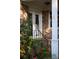 Inviting brick porch with a white pillar and staircase, framed by colorful blooming azalea bushes at 731 Pitt St, Mount Pleasant, SC 29464