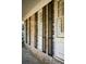 Close up of the brick exterior of the home featuring shuttered windows and a covered porch at 731 Pitt St, Mount Pleasant, SC 29464