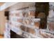 Close-up of brick fireplace with a white mantle, showcasing the texture and design at 731 Pitt St, Mount Pleasant, SC 29464