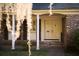 Close up of the home's entrance featuring brick exterior, white painted door, and white trim at 731 Pitt St, Mount Pleasant, SC 29464