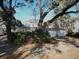 Charming home exterior, featuring a brick facade with an attached two-car garage and lush landscaping at 731 Pitt St, Mount Pleasant, SC 29464