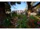 Charming home exterior, showcasing a brick facade complemented by a lush garden filled with vibrant azaleas at 731 Pitt St, Mount Pleasant, SC 29464