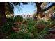 Charming home exterior, showcasing a brick facade complemented by a lush garden filled with vibrant azaleas at 731 Pitt St, Mount Pleasant, SC 29464