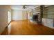 Spacious living area with brick fireplace, built-in shelving, and access to the outside at 731 Pitt St, Mount Pleasant, SC 29464
