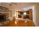 Open-concept living area with brick fireplace, built-ins, and a view of the kitchen at 731 Pitt St, Mount Pleasant, SC 29464