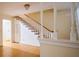 Classic staircase featuring wood treads, white risers, and decorative spindle railing in a bright, open space at 731 Pitt St, Mount Pleasant, SC 29464