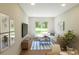 Inviting living room with a large window, comfortable seating, and stylish décor at 7424 Indigo Palms Way, Johns Island, SC 29455