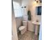 Cozy bathroom features white vanity and a window providing natural light at 7724 Linsley Dr, North Charleston, SC 29418