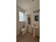 Charming half-bathroom with pedestal sink and decorative tile flooring at 7724 Linsley Dr, North Charleston, SC 29418