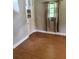 Bedroom featuring hardwood floors, neutral wall color, and a window with curtains at 7724 Linsley Dr, North Charleston, SC 29418