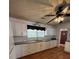 Kitchen showcasing white cabinets, a sleek countertop, and modern faucet at 7724 Linsley Dr, North Charleston, SC 29418